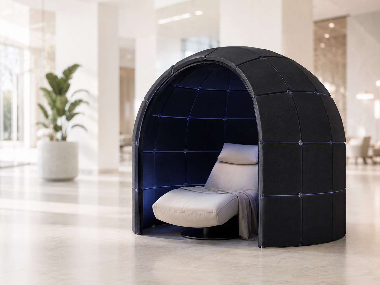 A Cognition nap pod — panels forming a half-dome over a reclining chair.